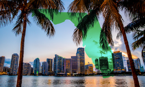 Florida state silhouette over Miami skyline